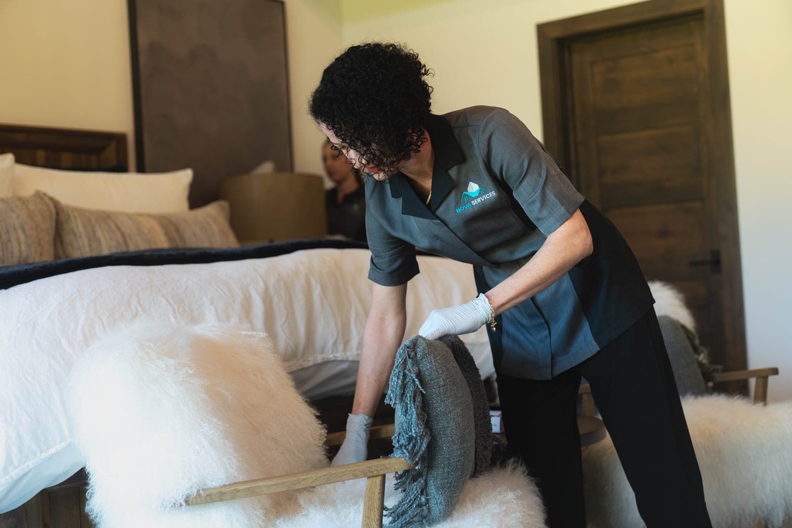 Professional maid cleaning a beautiful home