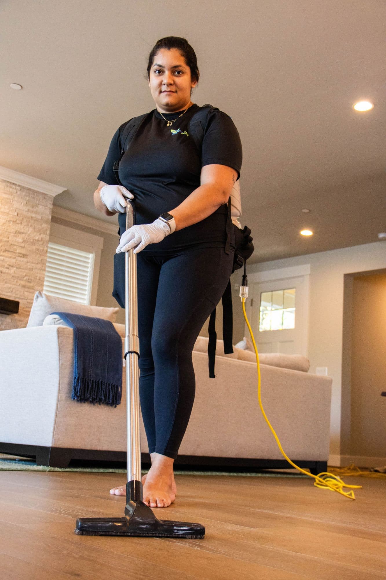 Vacuuming a living room during a cleaning visit in Sammamish, WA