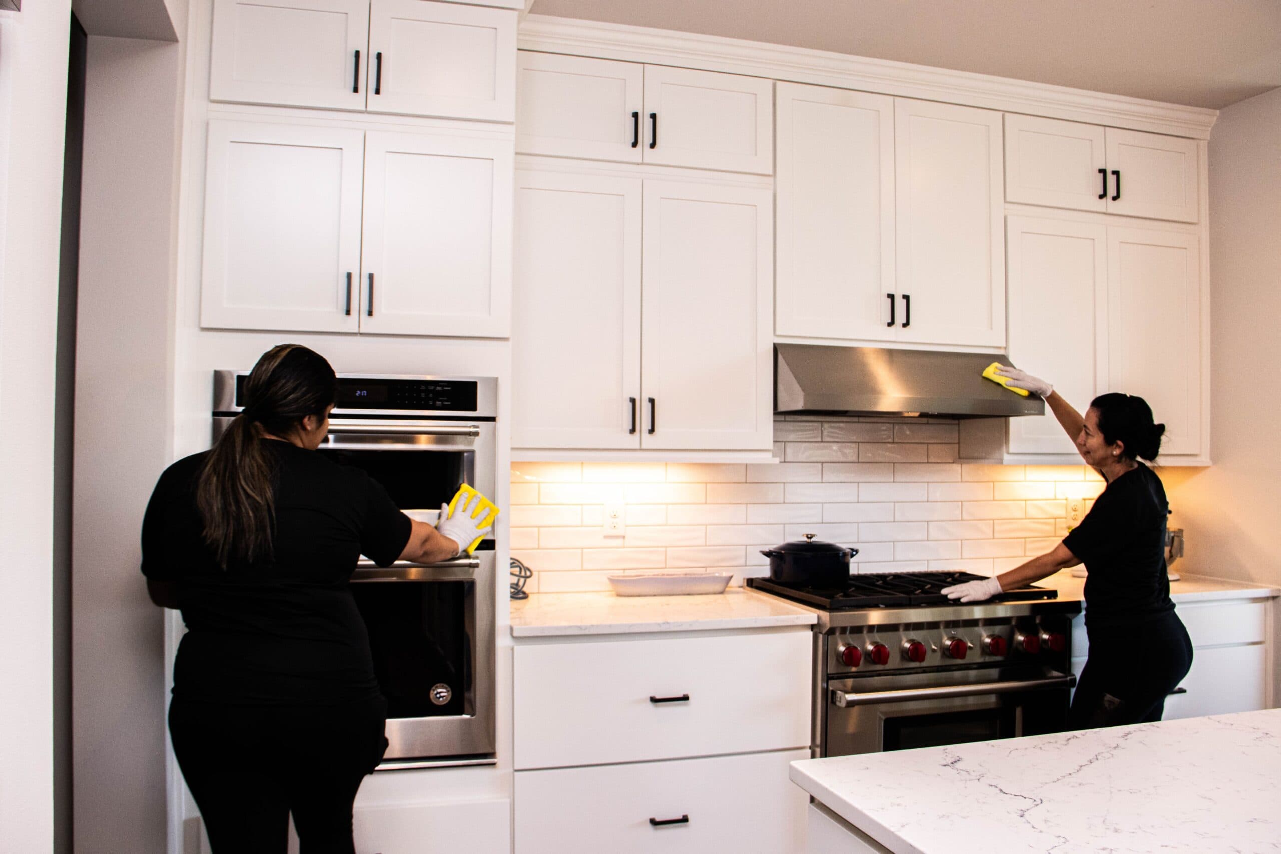 Nova Cleaning team working in kitchen